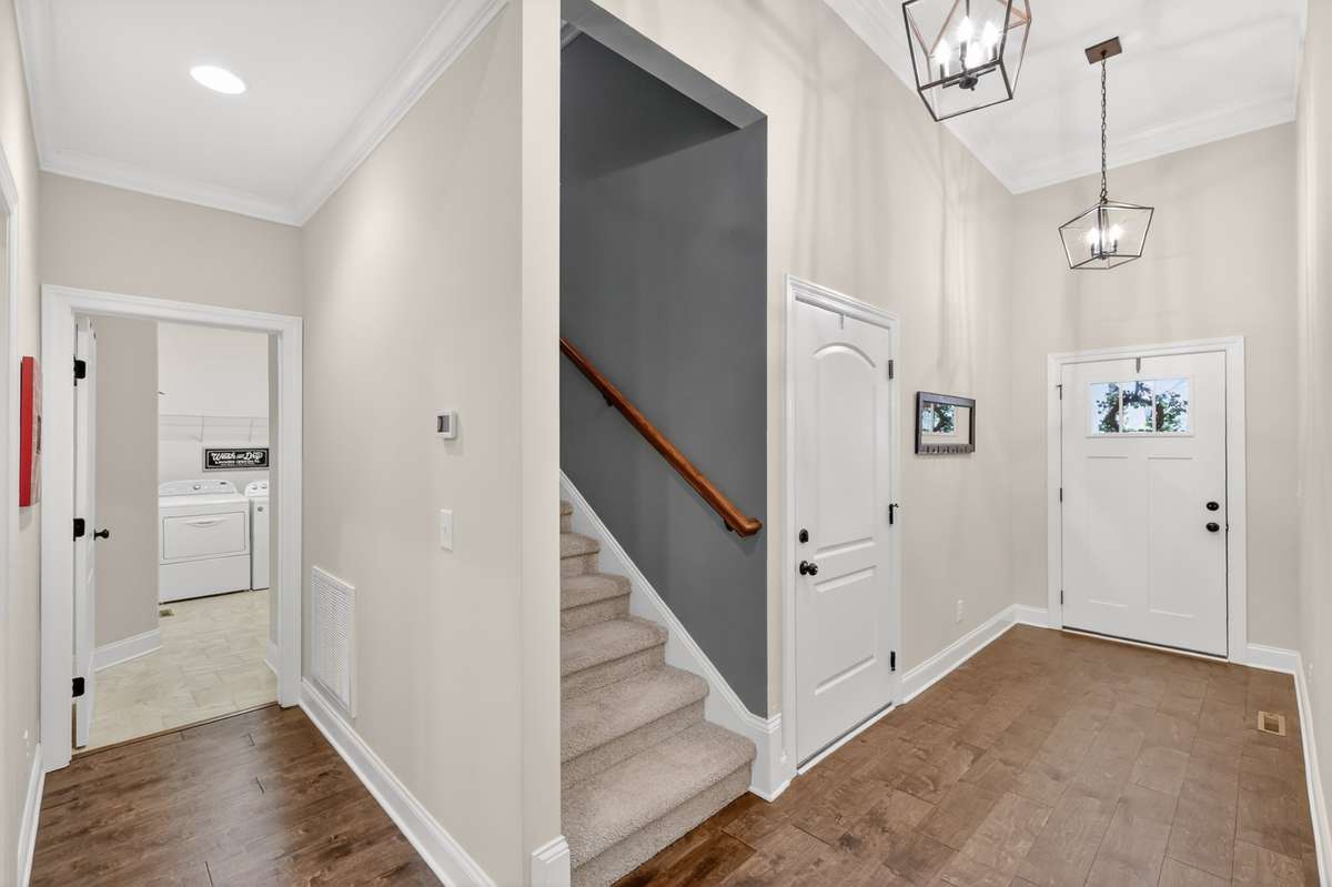 Stairs off entryway leading to bonus room and 4th bedroom