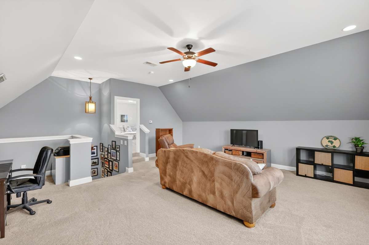 Bonus room with short stairway to 4th bedroom and 3rd full bathroom