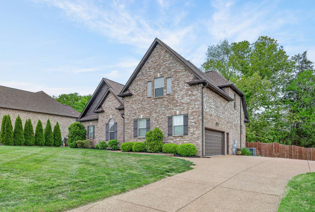 Large driveway and side entry 2 car garage.