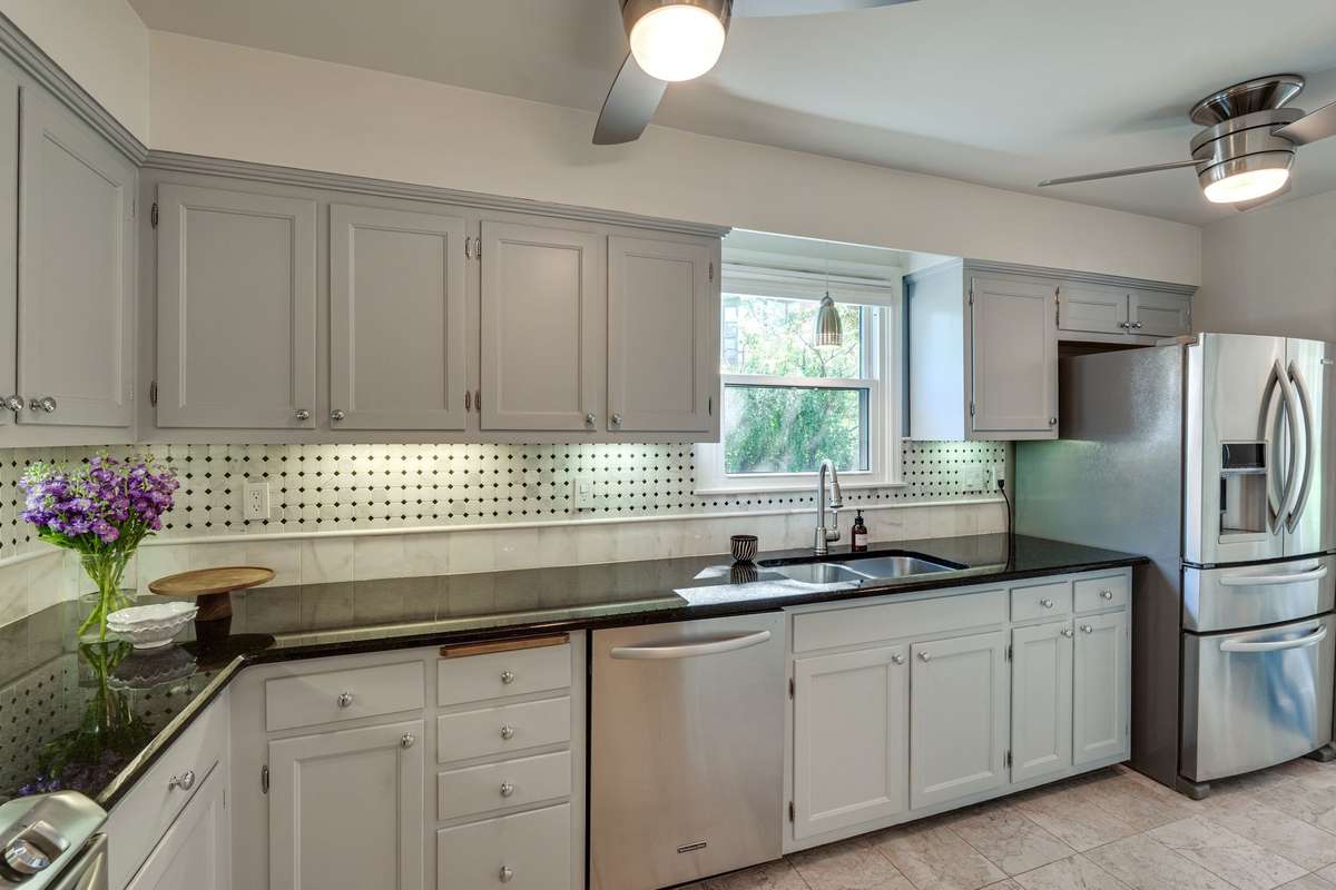 Granite countertops and dual ceiling fans for added comfort