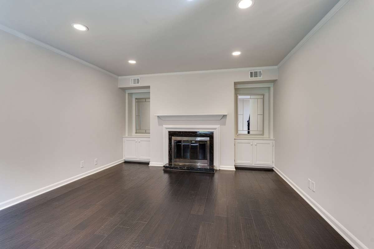 The living area is enhanced by custom built-in storage, offering both style and functionality