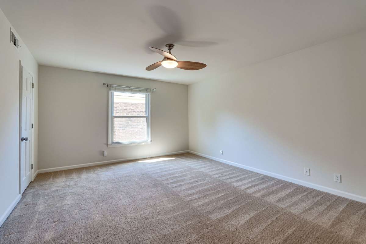 Bedroom #2 is generously sized, has a modern fan light and lush carpeting