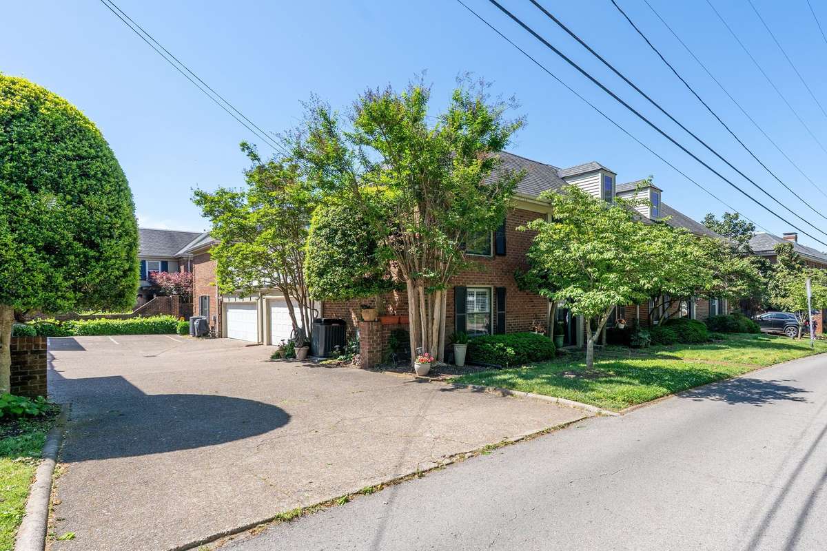 The entrance to the driveway serving the 4 townhomes is tucked off the side street (Richardson) for a quiet, private setting that feels seamlessly connected to the neighborhood.