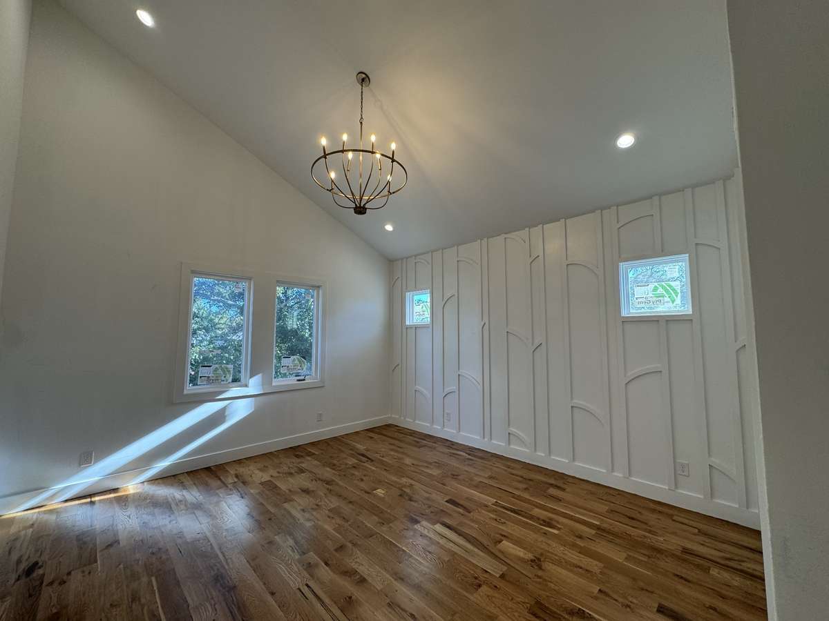 Vaulted ceiling in the Primary Bedroom with an accent wall.