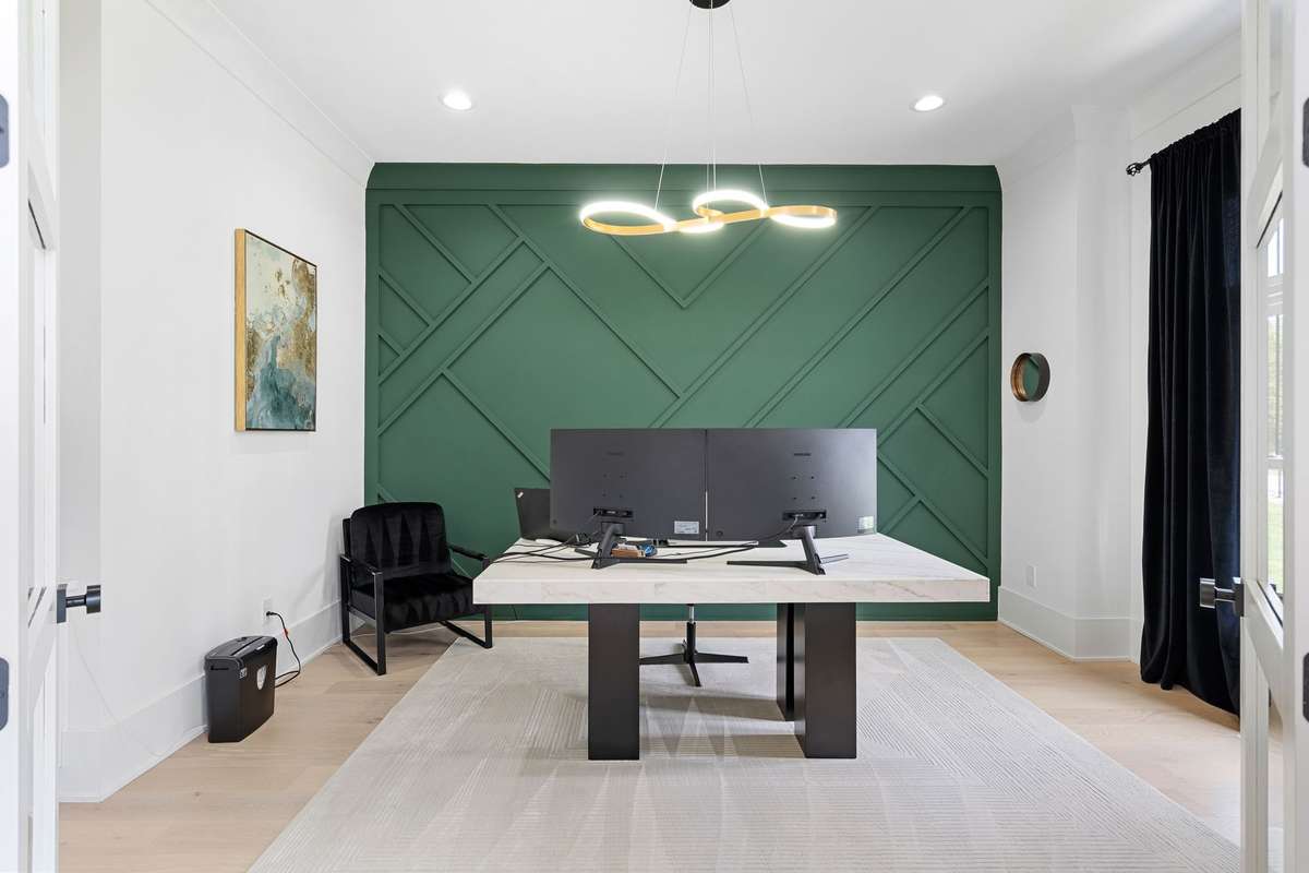 A dedicated home office with custom accent wall is ideal for those of you working from home.