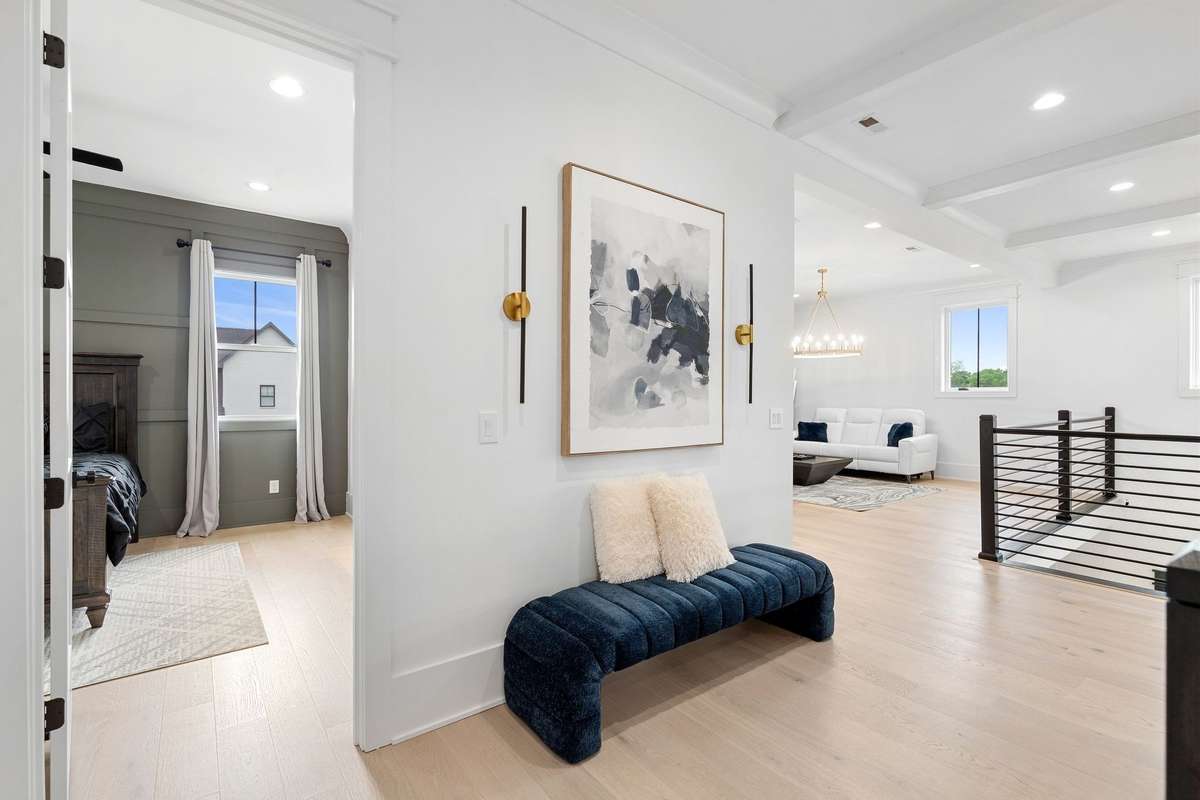Wide, open hallway with designer details and seamless flow between living spaces.