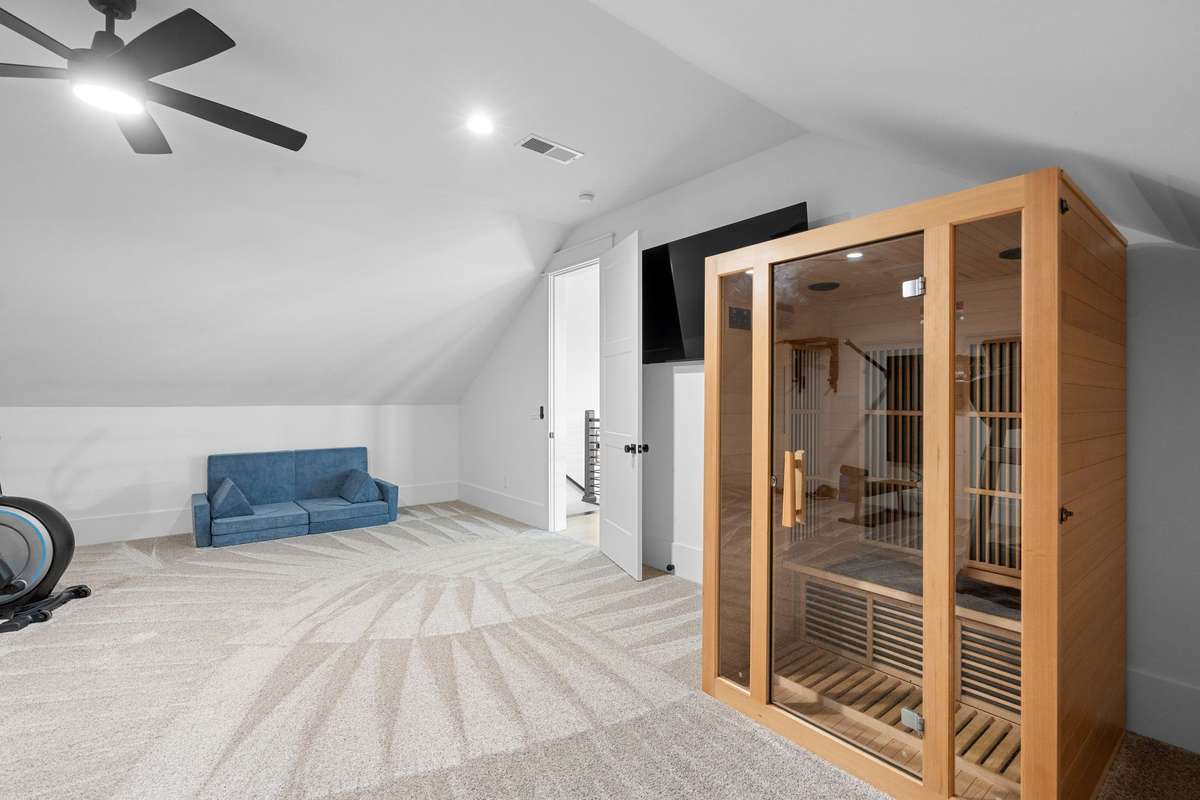 Versatile bonus room featuring a private in-home sauna—perfect for relaxation and wellness. The sauna and Tonal (on the wall workout equipment) is negotiable with an acceptable offer.