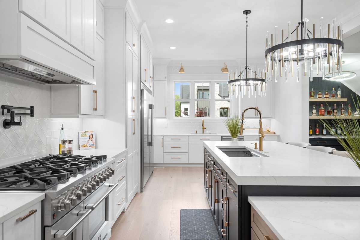 Chef’s dream with a 48” gas range, expansive prep space, and seamless flow into the main living areas.