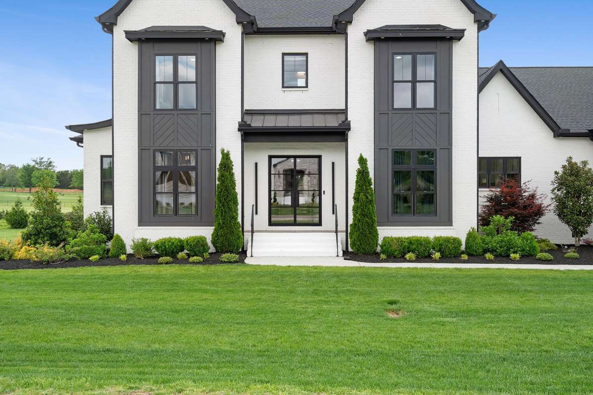 Stately and elegant, this grand front entry with Iron Lion door welcomes you into this one-of-a-kind custom home.