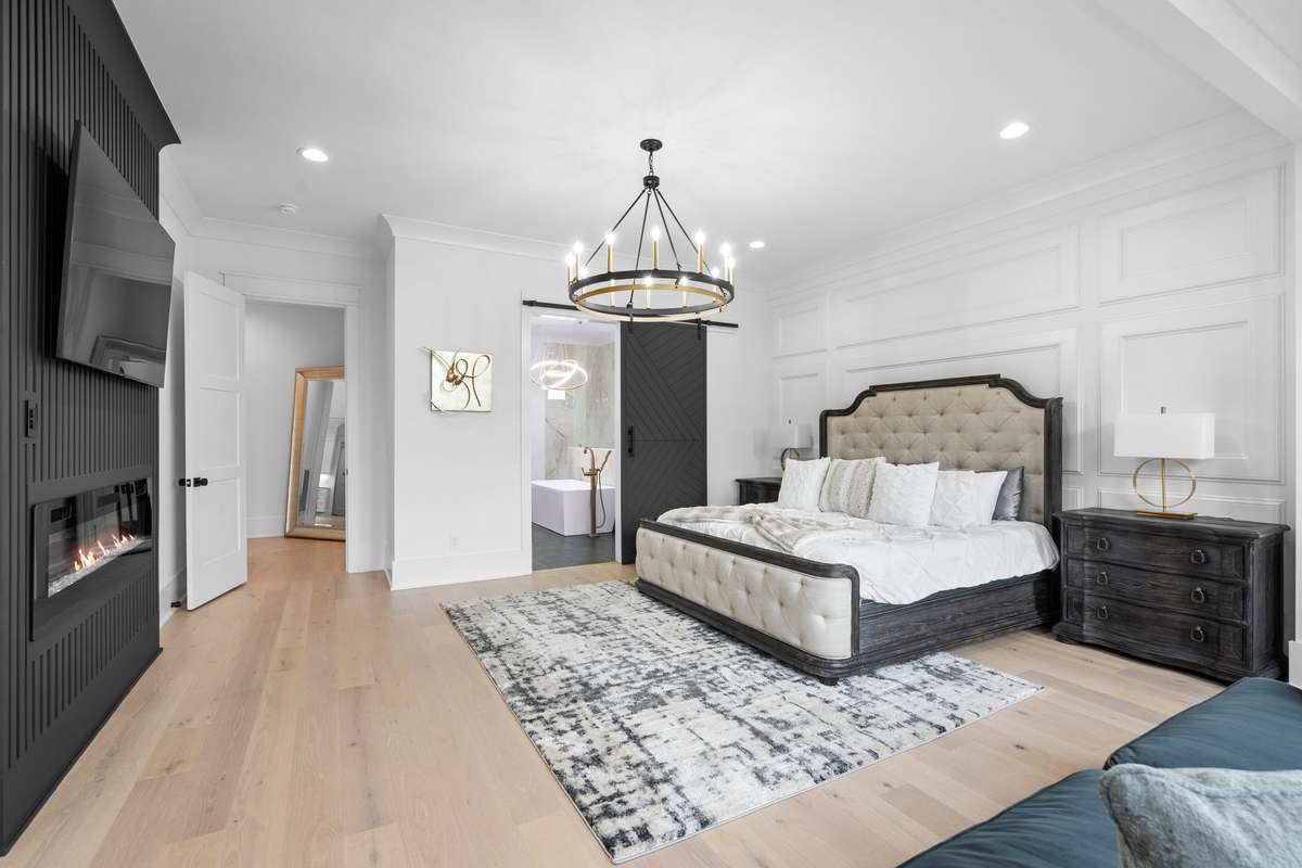 Private retreat featuring designer finishes and direct access to spa-like bath.