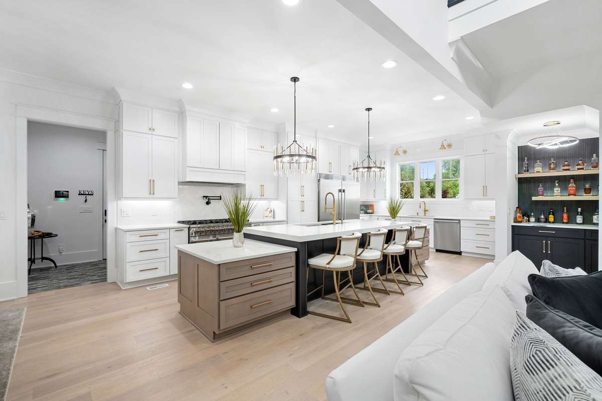 Chef’s kitchen with a massive 15’ island, custom cabinetry, and high-end finishes—perfect for entertaining and everyday living.
