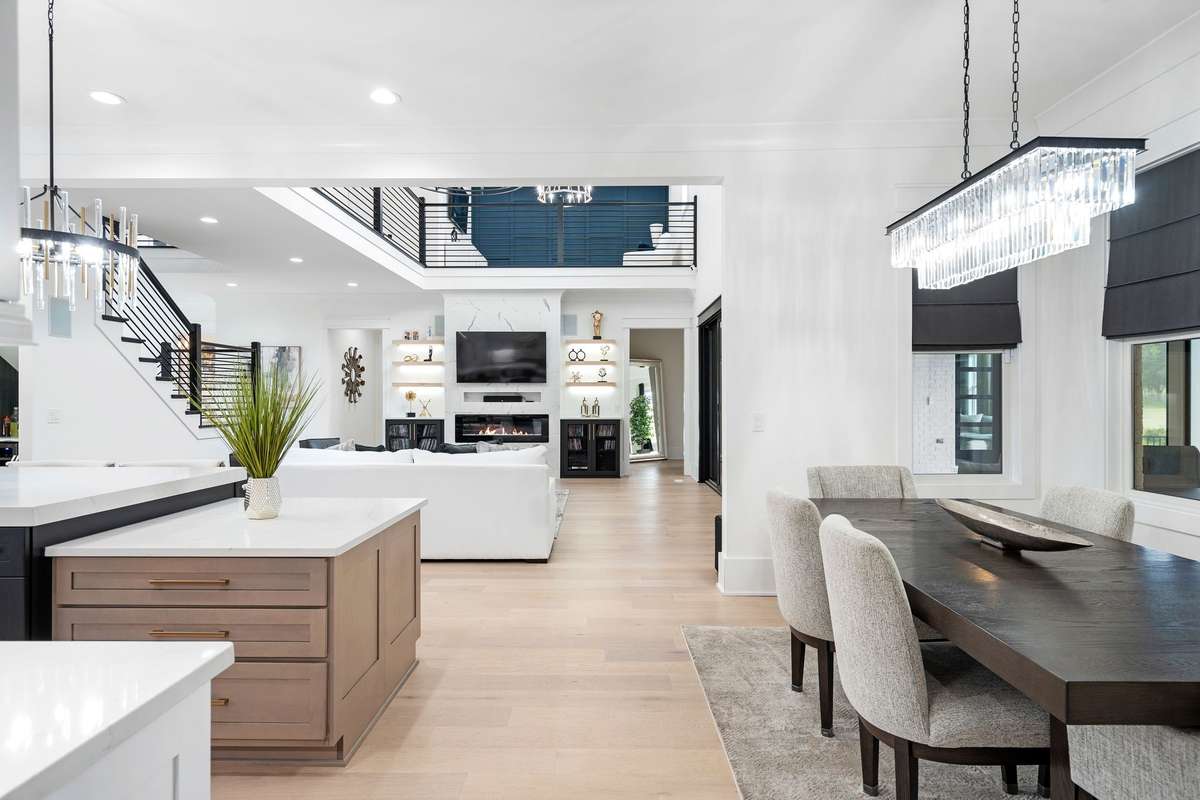 Seamless transition from dining to the expansive living area, showcasing the home’s open floor plan.