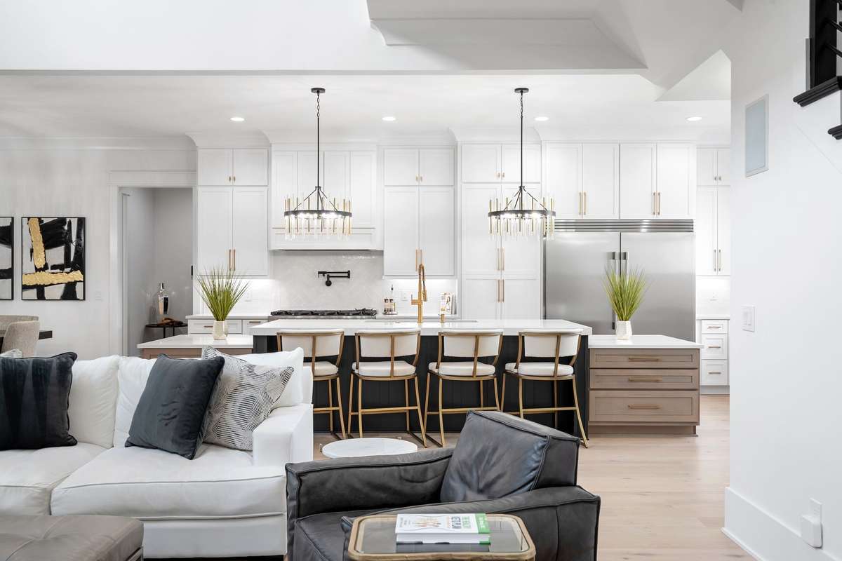Gourmet kitchen (23x13) with oversized 15’ island, custom cabinetry, and eat-in dining.