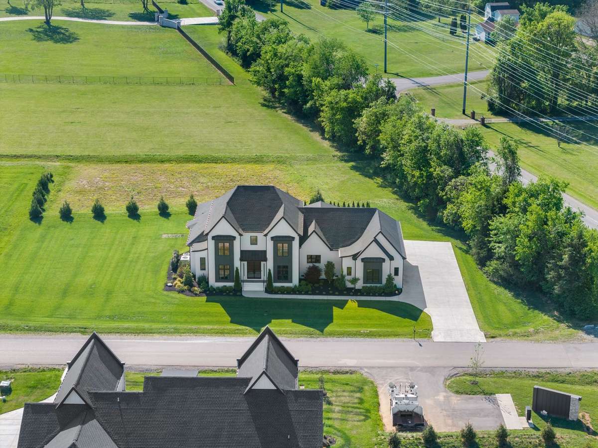 Striking front elevation with clean contemporary lines, professional landscaping, and ample parking.