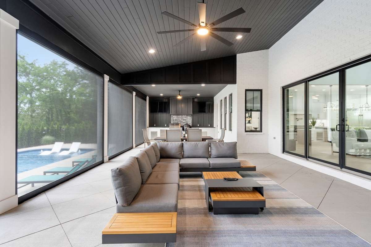 Fully retractable doors open wide to blend interior elegance with outdoor living space.
