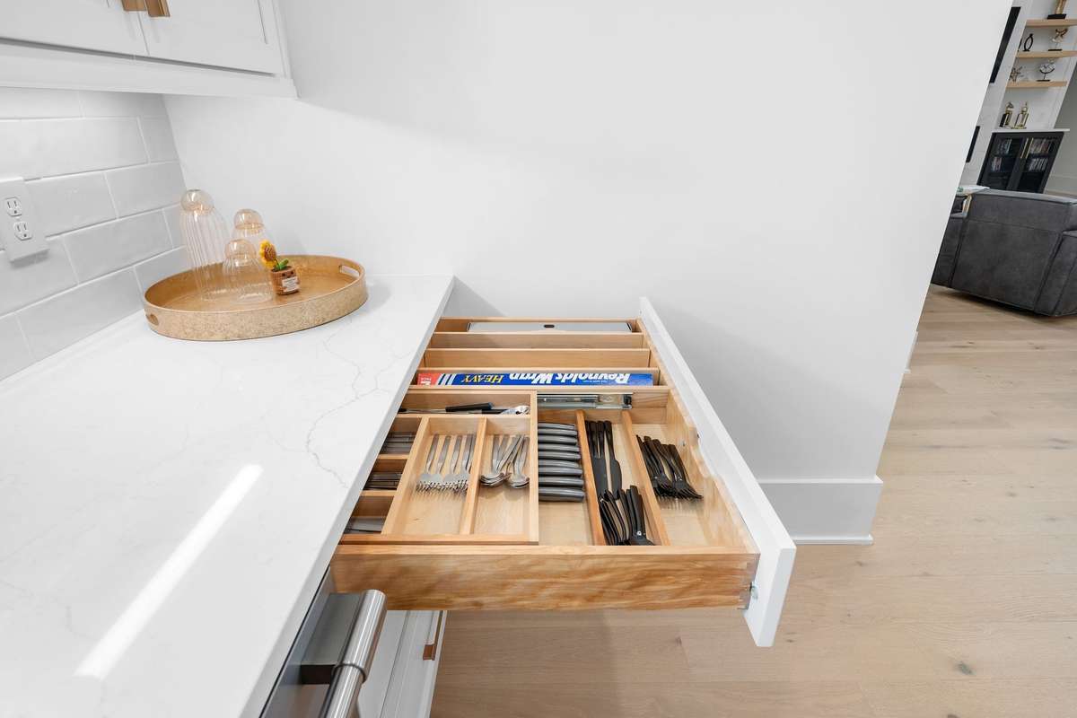 Thoughtfully designed built-in drawers with premium organizers, offering both beauty and efficiency.