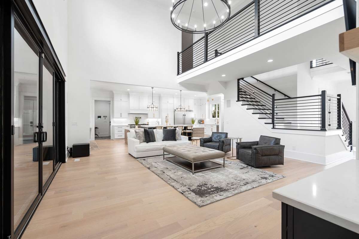 Spacious living area ideal for entertaining, highlighted by high ceilings and designer finishes.