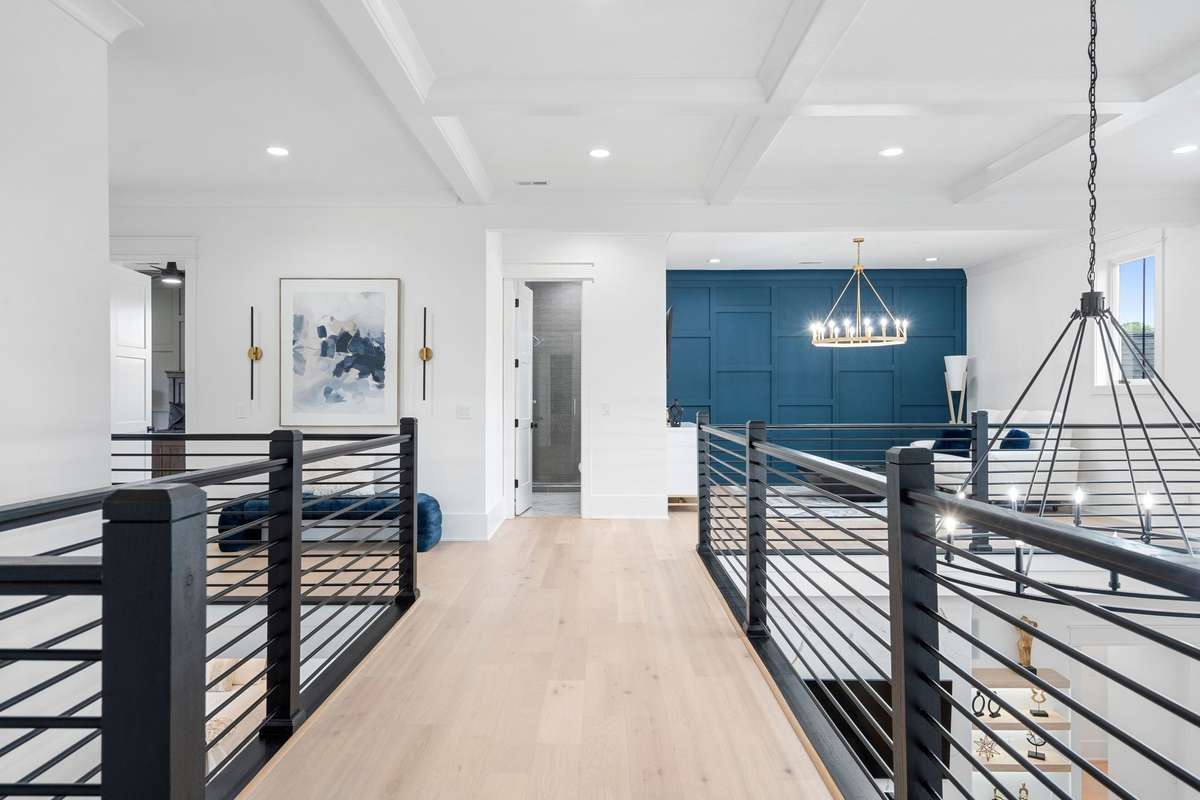 Airy, upper-level loft with open railing, perfect for additional living or flex space.