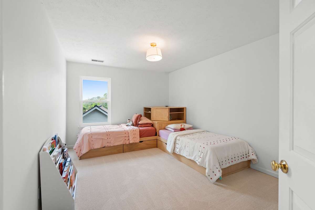 guest bedroom with walk-in closet
