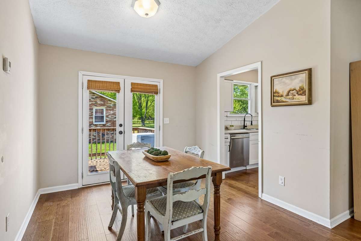 Dining area with easy access to the back yard and adjoining the kitchen for easy entertainment options.