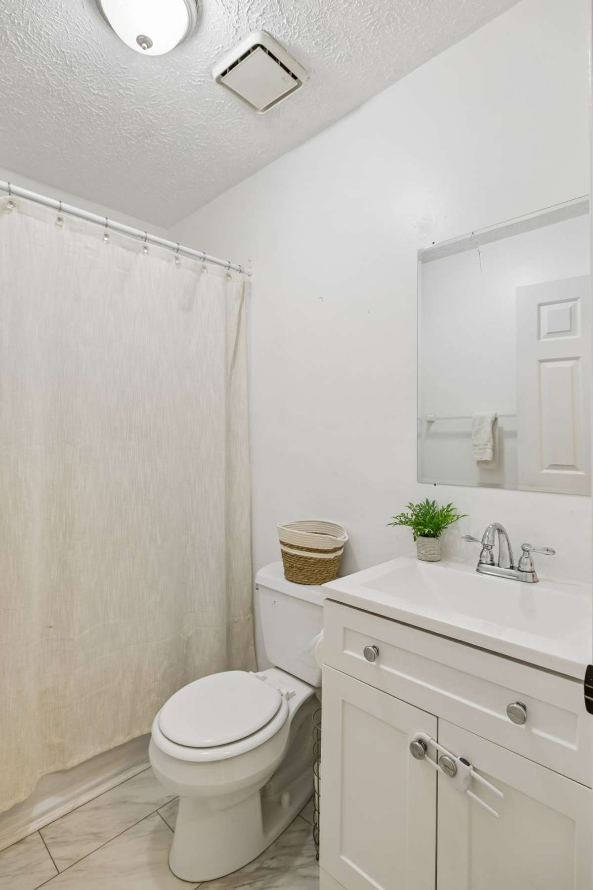 Full bath between bedrooms # 2 and 3.