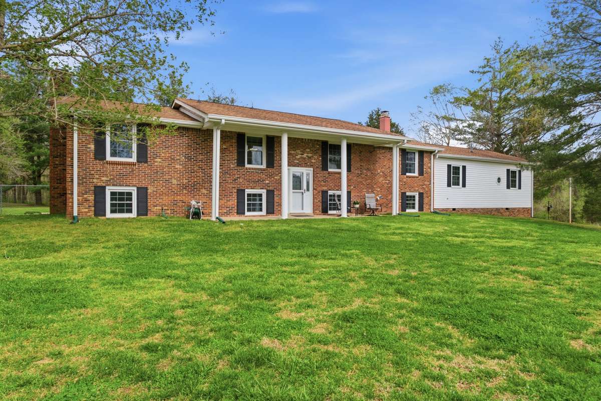This incredible property has a spacious home which sits on 18.5 acres and more than 1/4 mile frontage on the E Piney River.