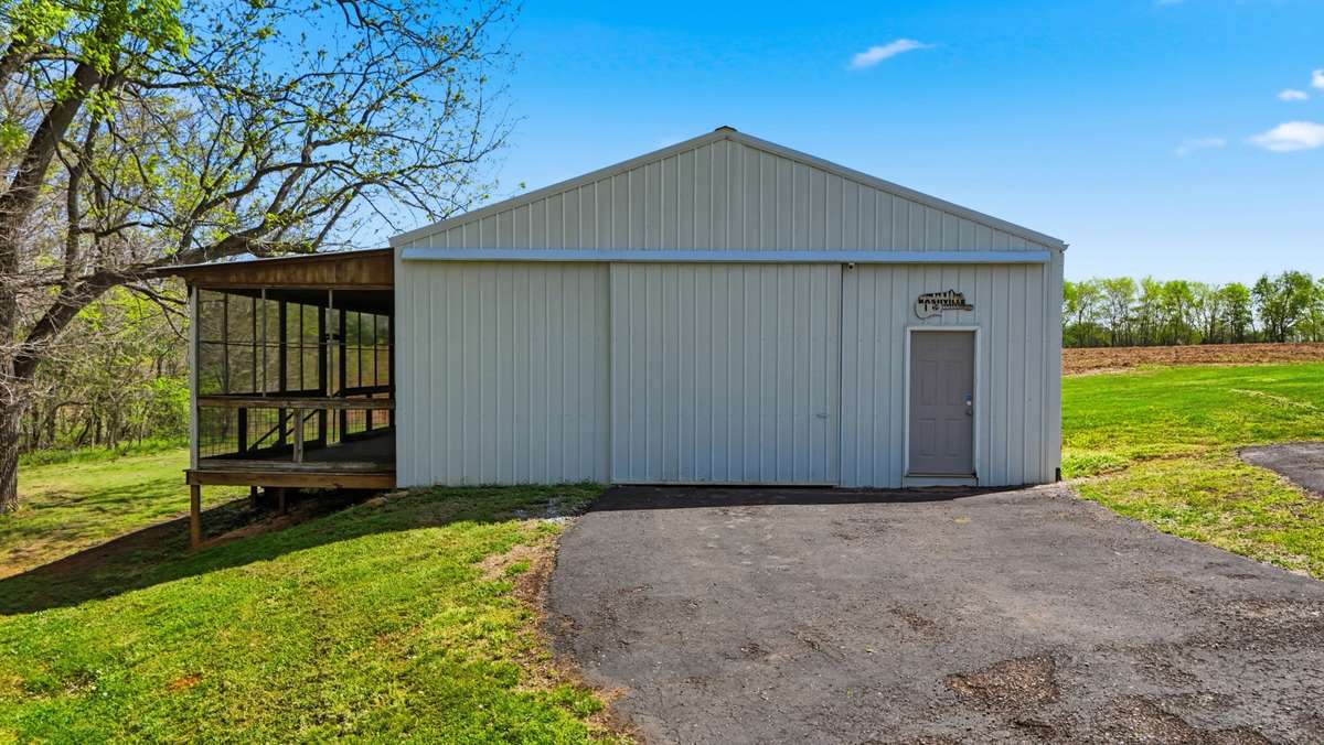 Let’s step outside to view the extra large garage/workshop!