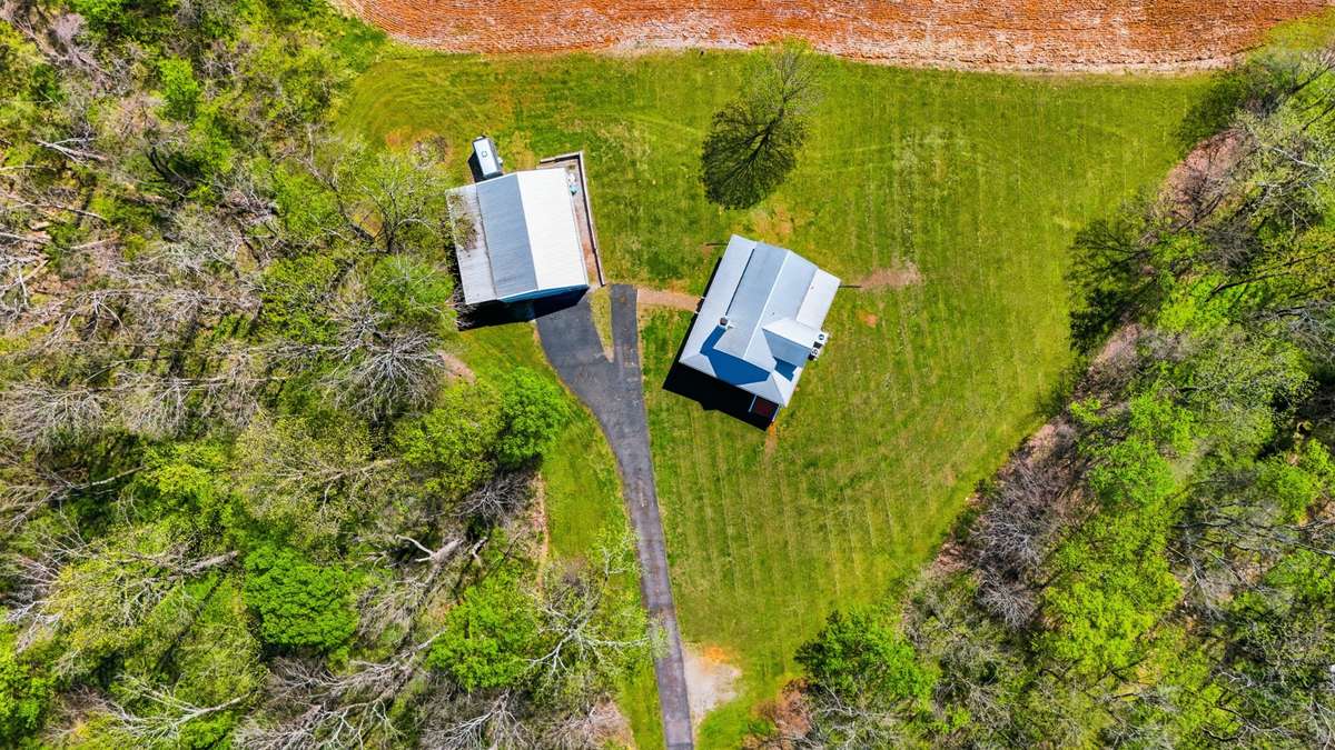 Tucked behind a tree line, the privacy this property offers is unmatched! While the 5 acres is mostly wooded, there is a large yard surrounding the home - offering space for pets/kids/grandkids while keeping the yardwork to a minimum.