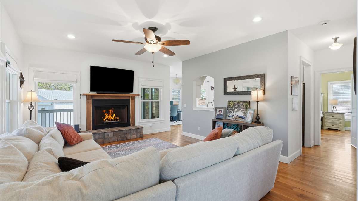 The entryway opens to your large living room featuring cozy fireplace (propane).