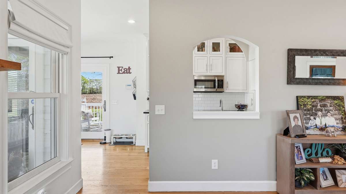 As you move from the living room to the dining, you’ll notice an arched cutout that allows for visibility between kitchen and dining - ensuring you’re never separated from your family or guests.
