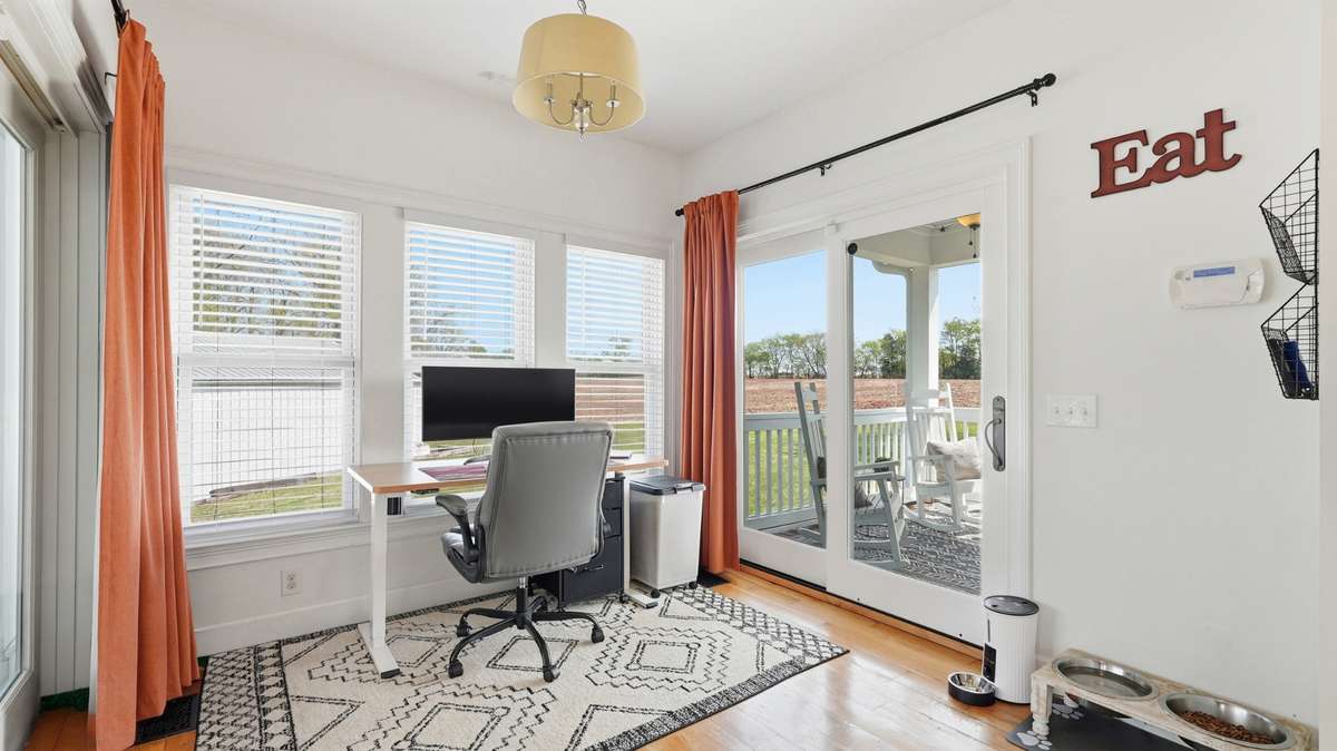 Use this space as a dining room OR a home office - as the sellers have it set up. Beautiful 180 views of the property from this room!
