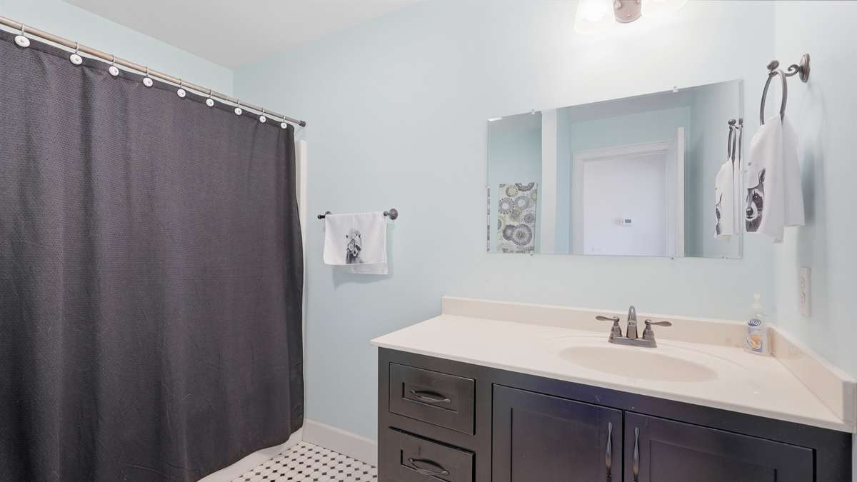 Between the two upstairs bedroom is a shared bathroom featuring a tub/shower combo.