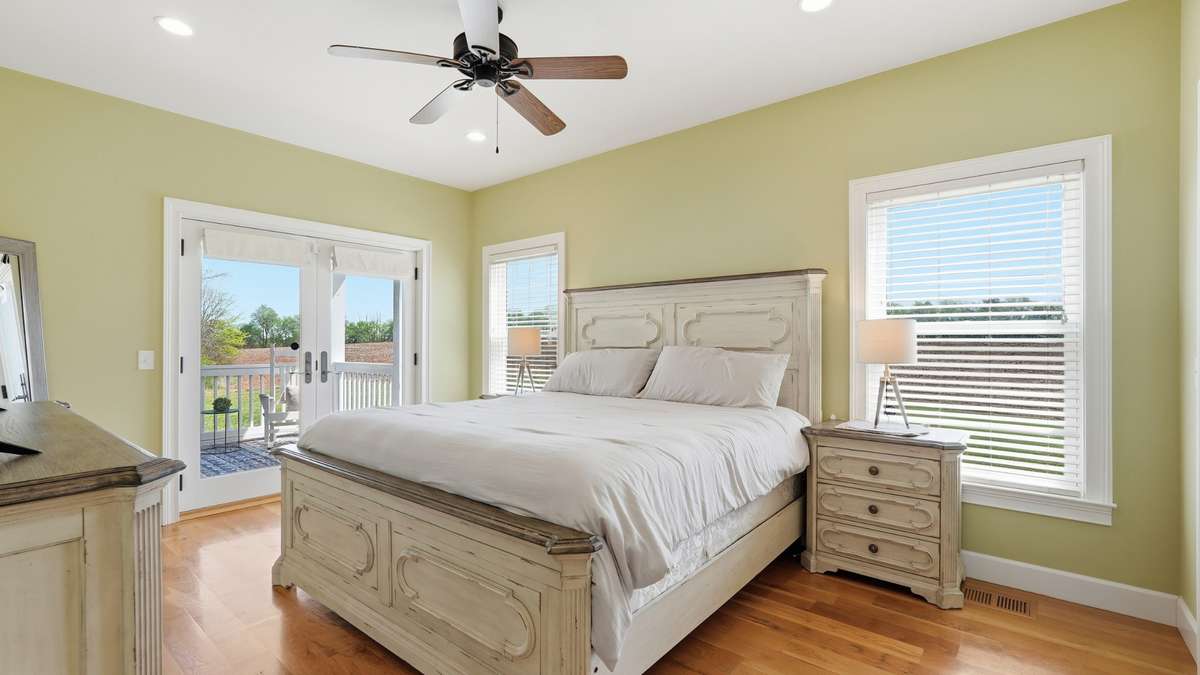 The primary bedroom also features french doors that open to your private porch.