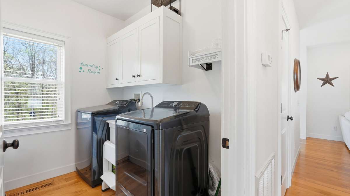 You’ll find the laundry room downstairs next to the primary bedroom, across from the kitchen. There’s even a project sink in here! You can select your own washer/dryer setup as the sellers will be taking these with them.
