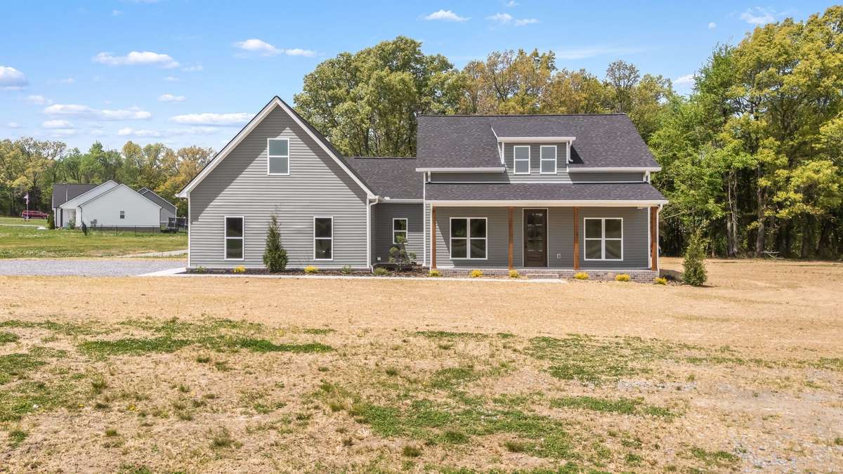 Front yard view - home sits on a large, level lot!