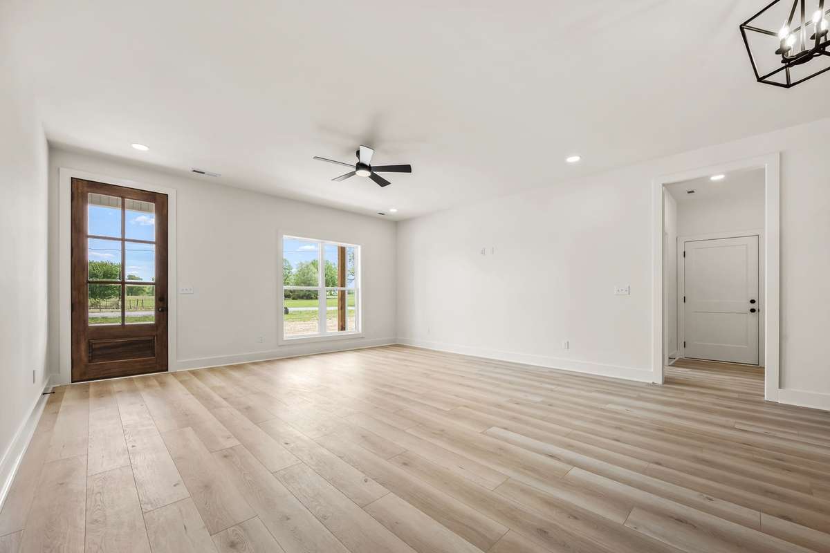 View of front door - glass front door offers tons of natural light!