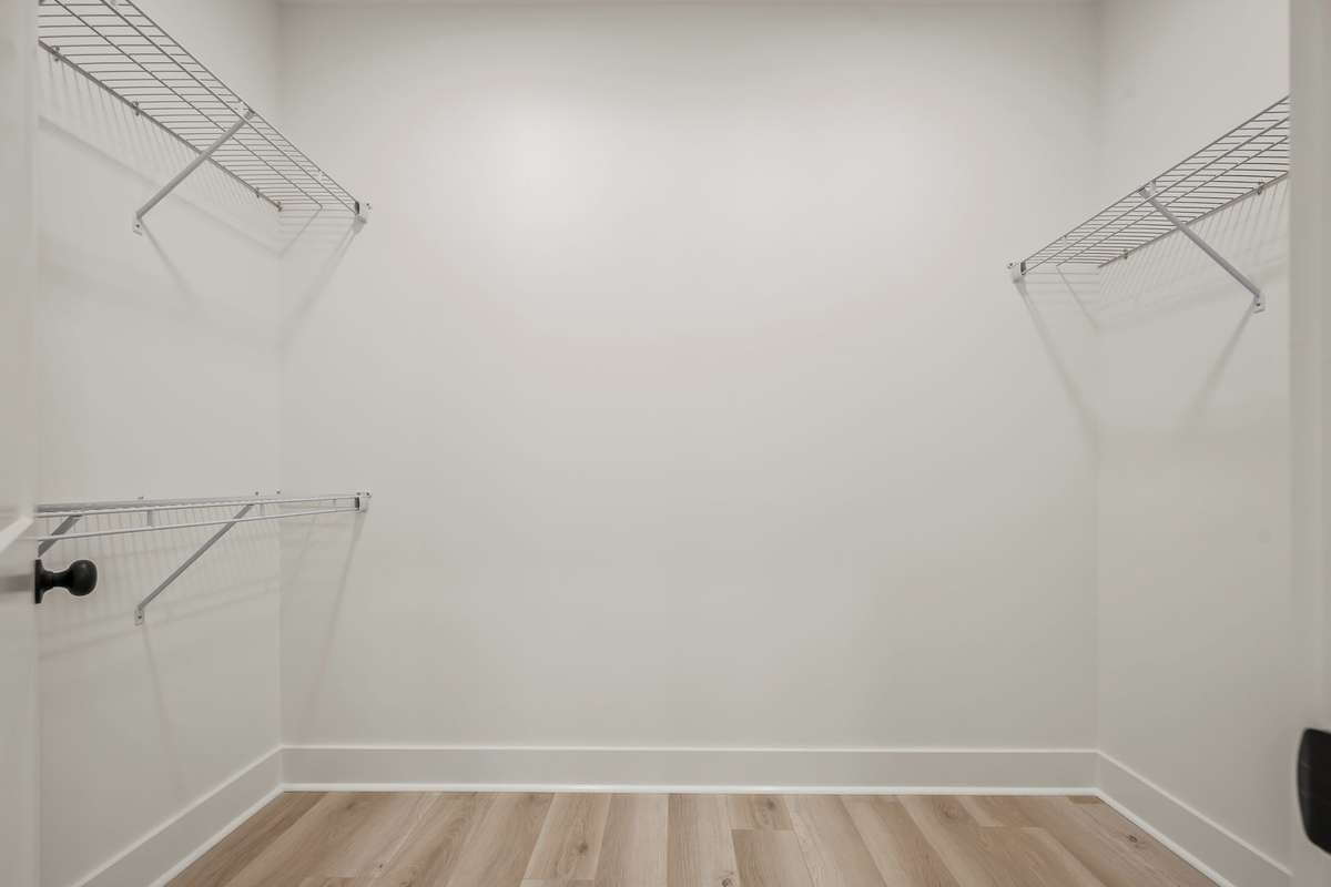 Walk in closet off of primary bathroom
