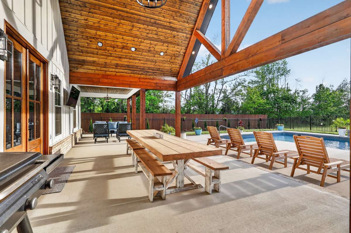 So much space back here... perfect for entertaining! Tv out back can remain. Chandelier is amazing and barely in the pictures.