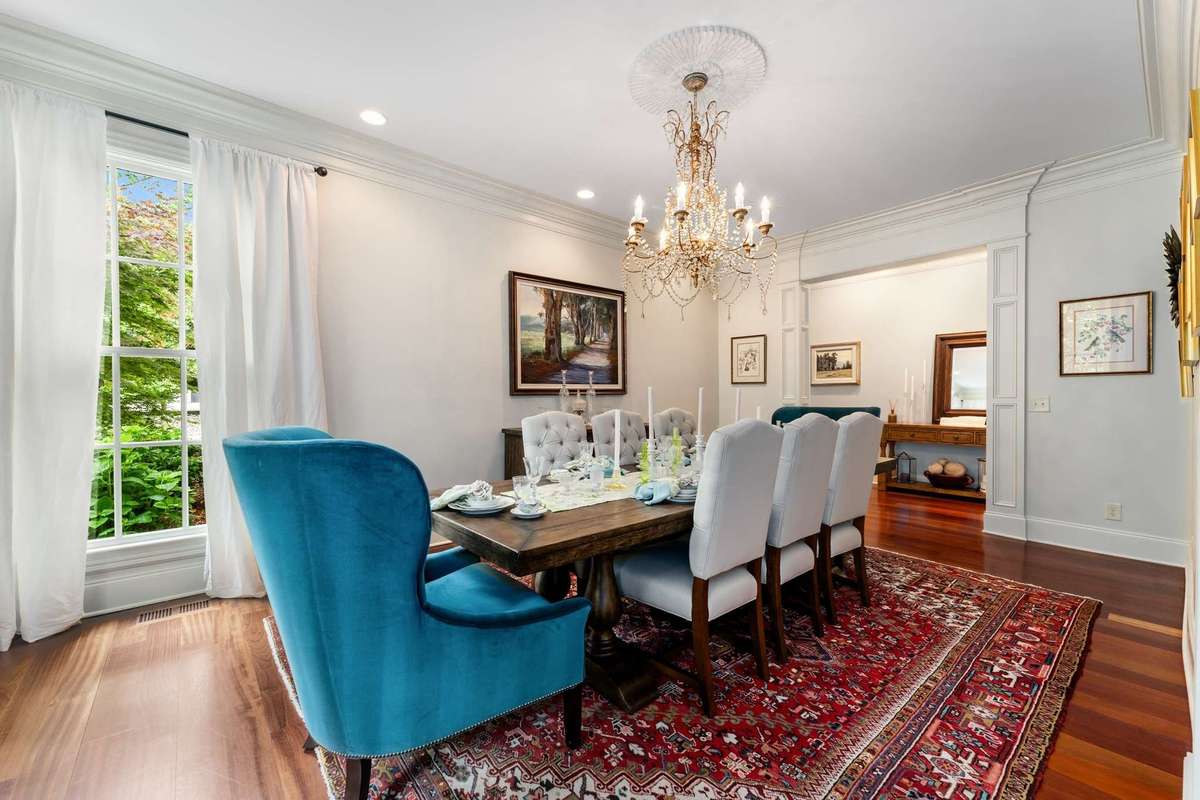 Right off the formal living room you flow in to the formal dining room...beautiful chandellier, wide cased openings and there is more of the deep crown moulding...