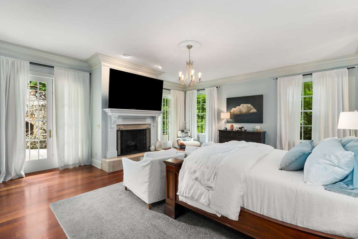 Notice this beautiful gas fireplace and matching French doors leading to the patio...
