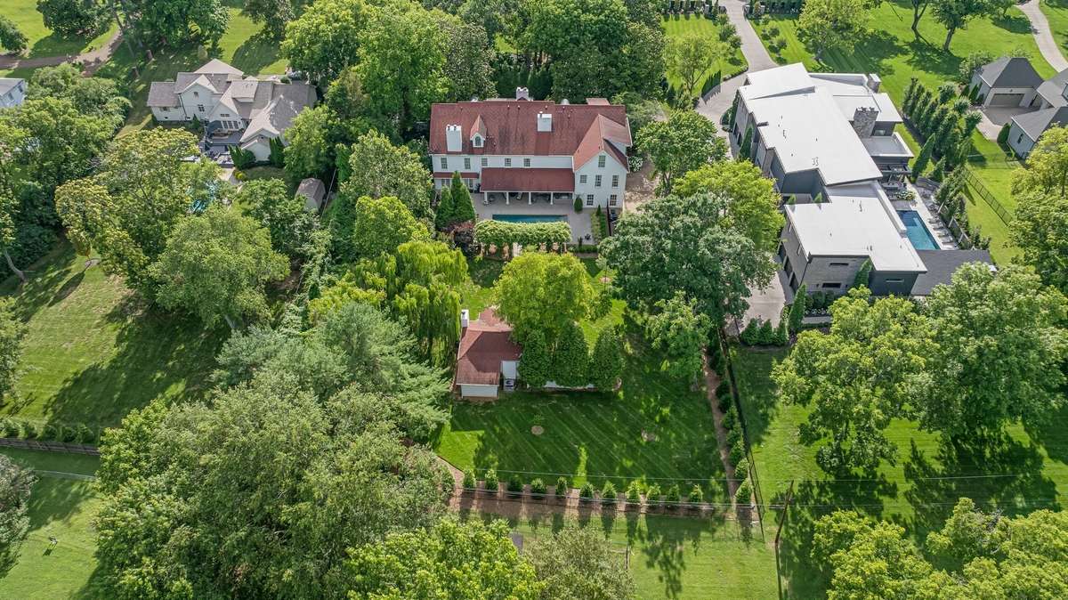 An aerial view...you can see the back of the property and the new fence that surrounds the sides and rear of the property...