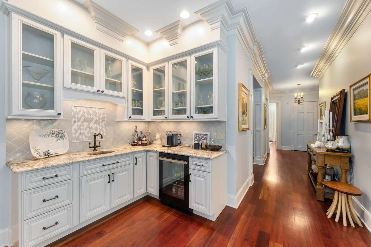 This beautiful bar has beverage fridge, sink and plenty of cabinets for all your glasswear and supplies...