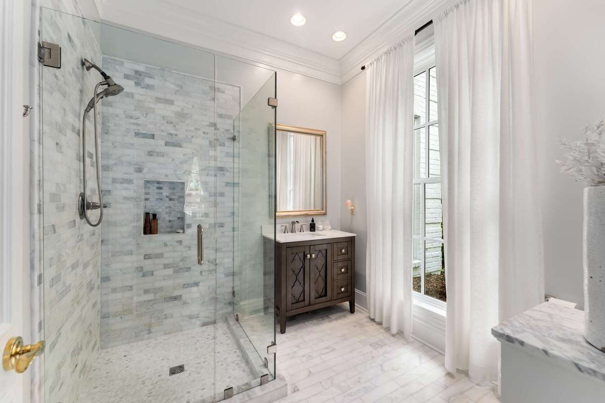 This serene marble bath was updated in 2022...