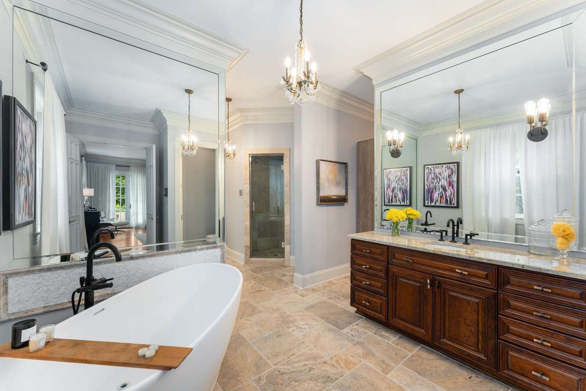 The exquisite spa-like retreat welcomes you in...includes a steam shower, his and her water closets and two separate closets...