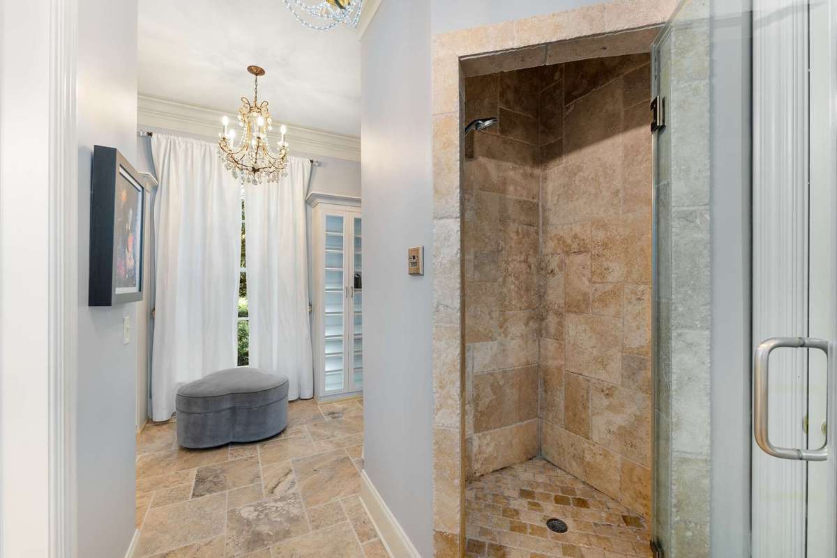 Another view of the steam shower and a peak into the accessory closet....