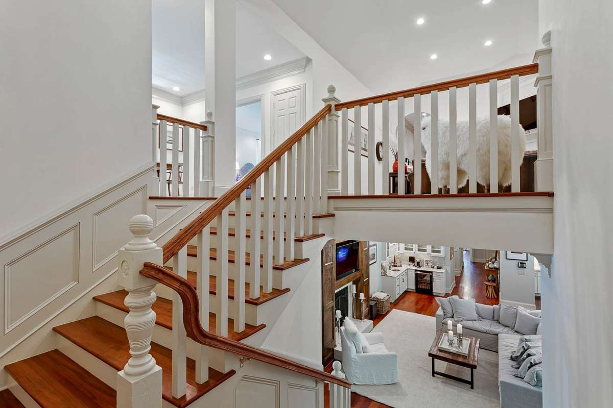 This staircase is so beautiful and extremely wide with a landing to break it up...