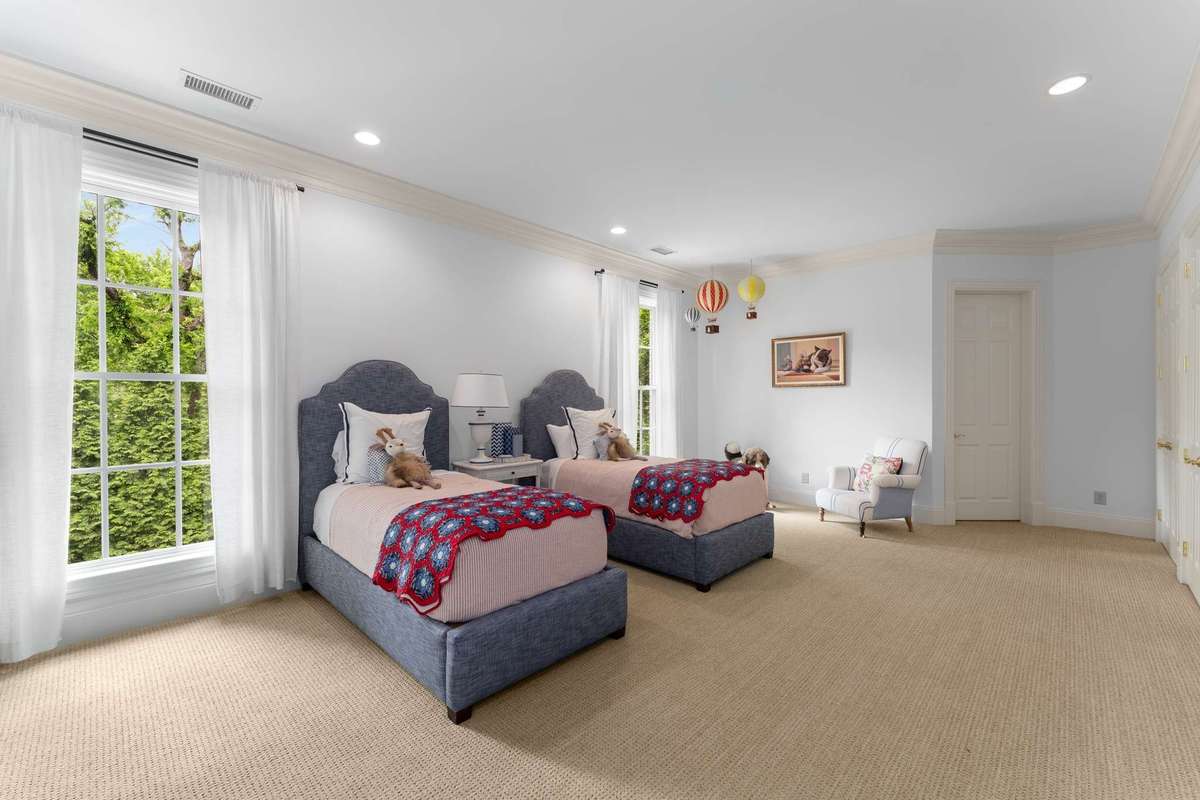 This children's room is so fun and playful....does anyone notice the size of this room?  Not seen in the picture is a wall of double door closets for plenty of storage...