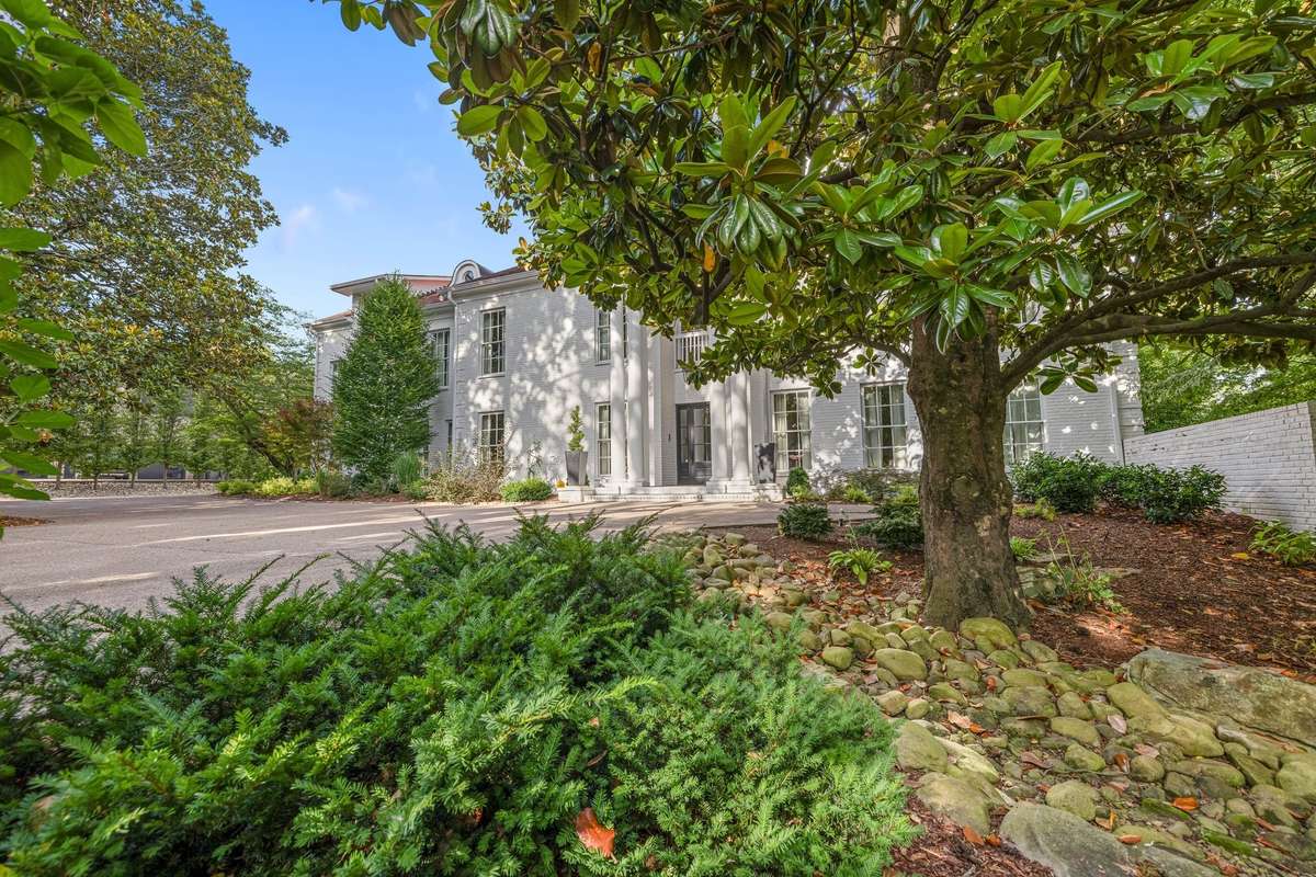 Another view....there are 5 huge and prominent Magnolia trees on this property...just perfect for a Southern Manor....