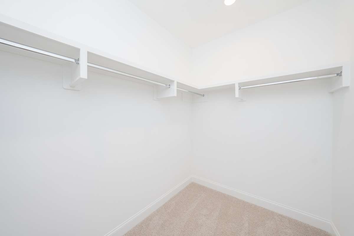 Wood shelving in primary closet