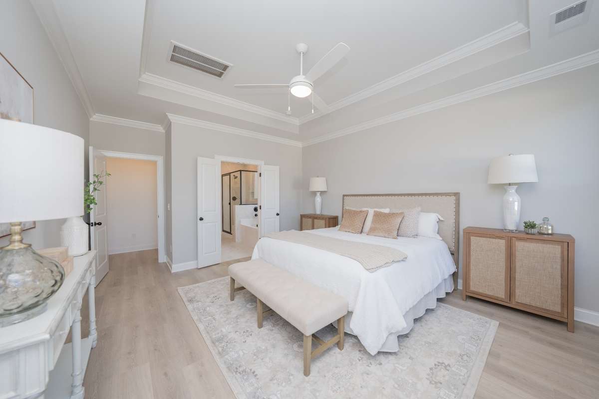 Relaxing primary suite with plank flooring